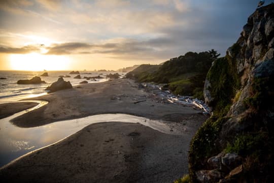 Rocky beach and tide pools at sunset