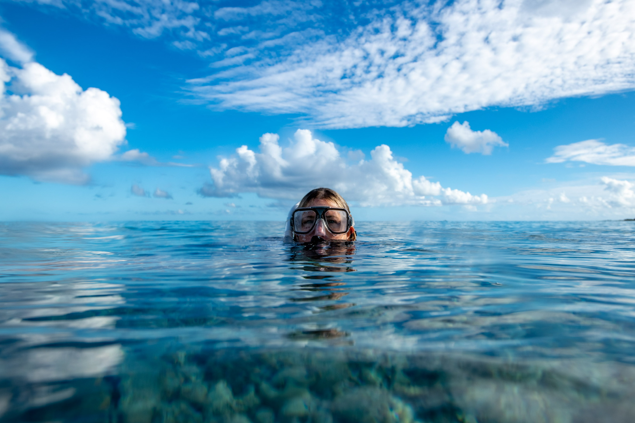 Snorkeler floating at the surface on a calm blue Florida water day